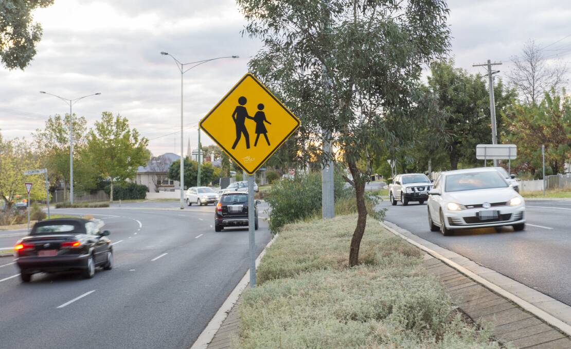 UPGRADE: The idea pedestrian-operated crossing over Condon Street at the Curtin Street intersection is popular with Kennington residents. Pictures: DARREN HOWE