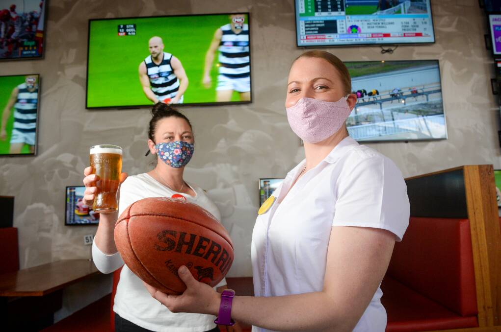 GAME ON: Mister Bobs staff Amanda Ryan and Ash Sullivan prepare for the AFL grand final on Saturday night. Picture: DARREN HOWE