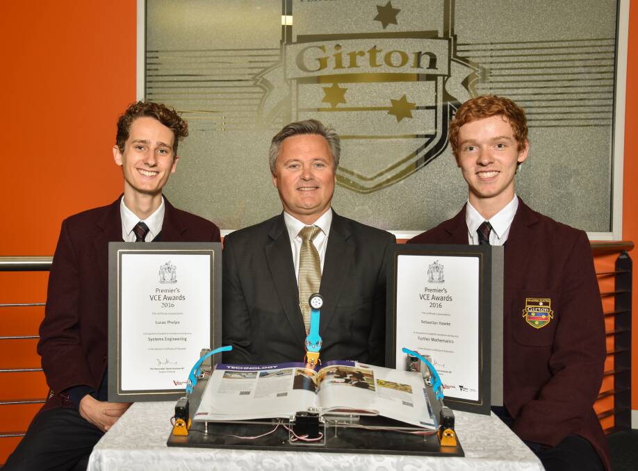 HARD WORKERS: Lucas Phelps, Girton Grammar headmaster Matthew Maruff and Sebastian Hawke with their certificates and Lucas' page-turning robot.