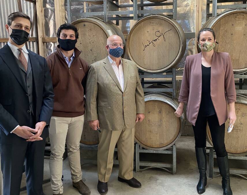 Andrew Papas (third from left) produces vinegar and other condiments with his sons George and Theo at The Heathcote Artisan. They also received a grant to help grow their business. Picture: Supplied.