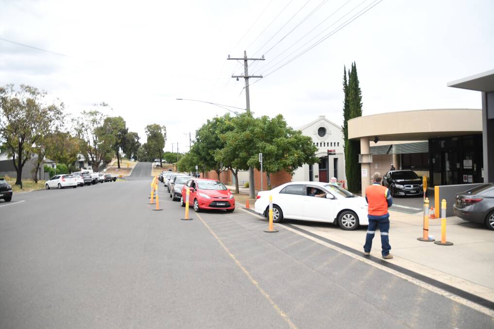 LINE: The Stewart Street drive-through and walk-in COVID-19 testing clinics had their hours extended on Saturday to try and cope with the demand. Picture: CHRIS PEDLER