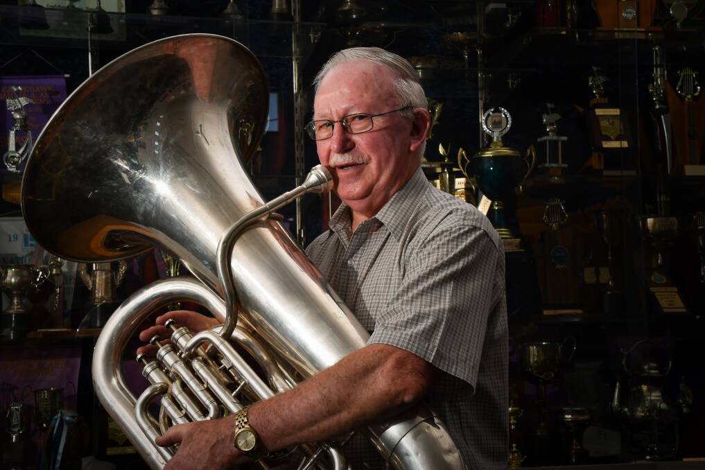 PASSION FOR PLAYING: Brian McMennemin has been performing with brass bands since the 1950s. He has received an Order of Australia Medal for services to music. Picture: NONI HYETT 