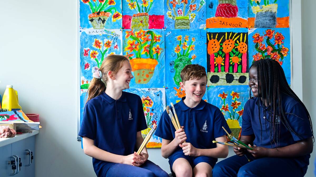 Camp Hill Primary School students Lexi O'Brien, Ben McAuliffe and Christina Napoleon were some of the almost 120 local students who have created work for Colouring the Competition at White Night. Picture by Brendan McCarthy
