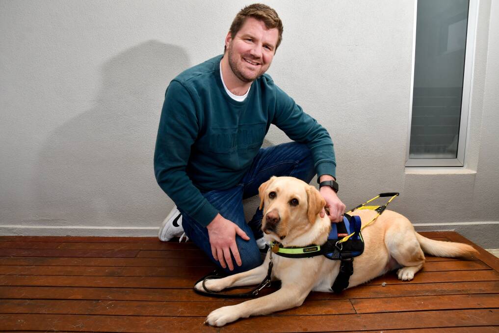 GOOD TEAM: Mitch Barri and his seeing eye dog Yogi. The pair came together last year and Yogi has helped improve the quality of Mitch's daily life. Picture: NONI HYETT