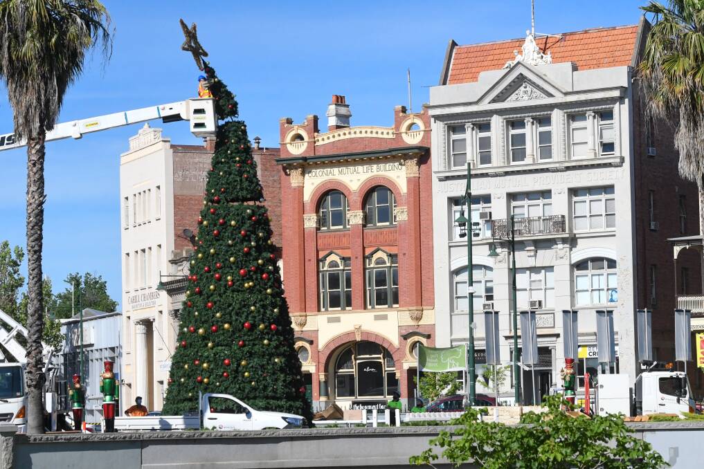 HOLIDAY SEASON: It's beginning to feel a lot like Christmas in Bendigo with the city's tree installed by council staff this week. Picture: NONI HYETT