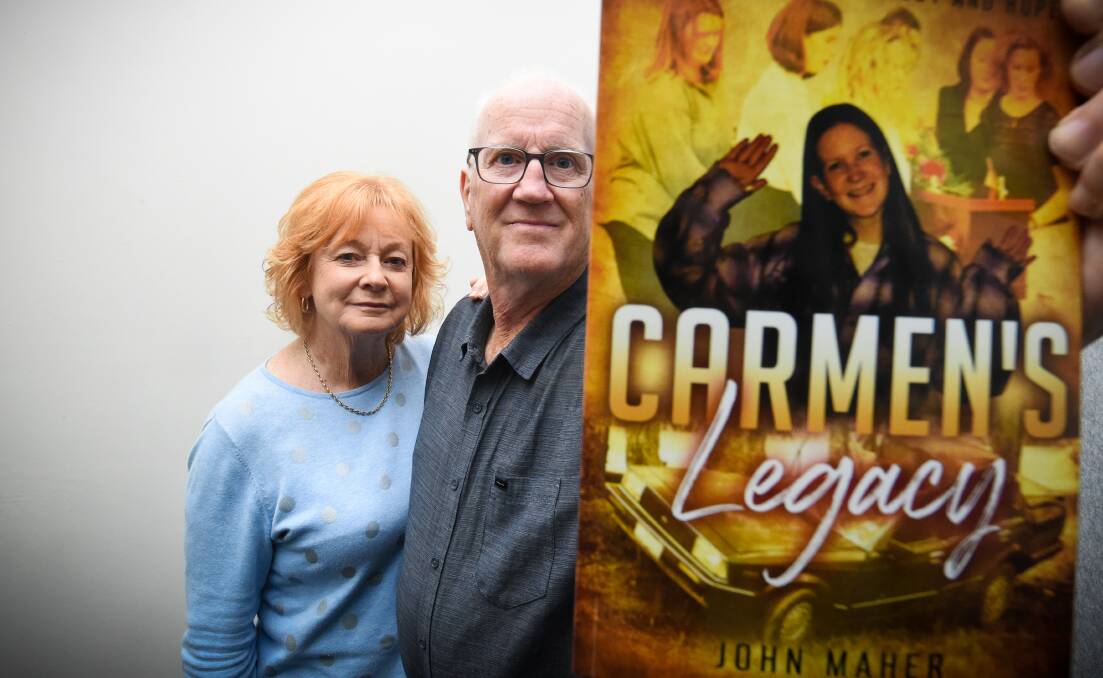 FAMILY: Ange and John Maher with John's new book - Carmen's Legacy - which he wrote to promote road safety. He hopes the message can reach high school students and their families. PIcture: DARREN HOWE