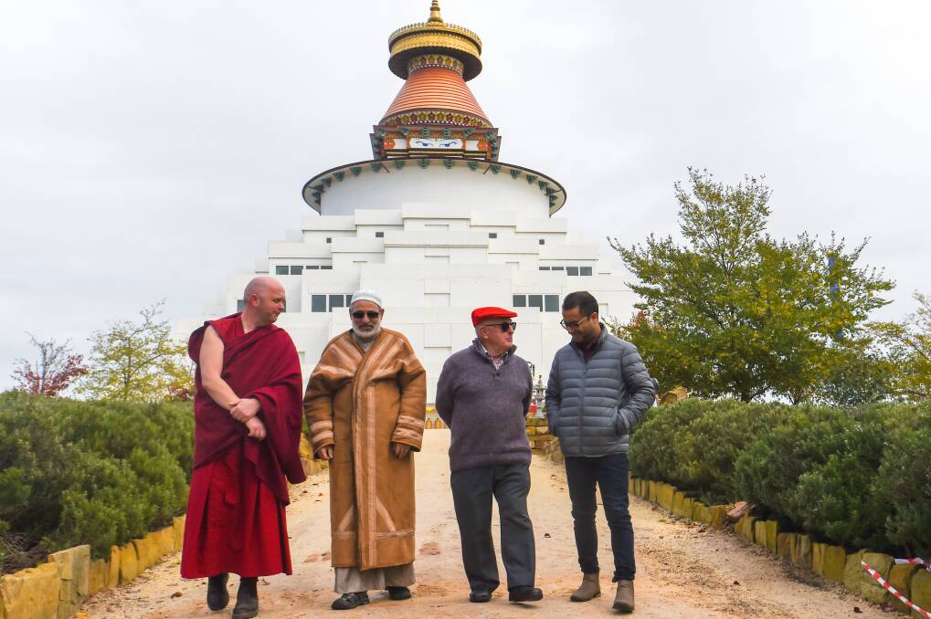 NEW ADDITION: Gyalten Dondrup, Atalla Khawaldeh, Howard Nathan and Abhishek Awasthi discuss the new interfaith library being built at the Great Stupa. Picture: DARREN HOWE