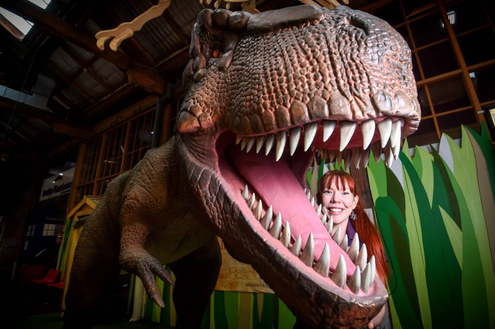DINO: Discovery general manager Alissa van Soest with the centre's newest team member - a 2.5 metre tall Tyrannosaurus Rex. Picture: DARREN HOWE
