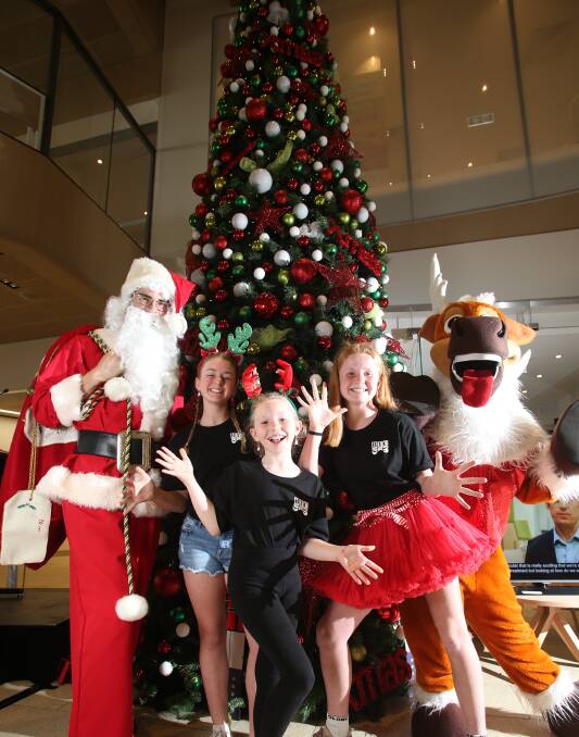 FEELING FESTIVE: Santa, Gemma Chisholm, Ingrid Fisher, Isla Devers and Rudolph are excited for this year's Kids Christmas Concert. It is at Bendigo Stadium on December 23. Picture: GLENN DANIELS