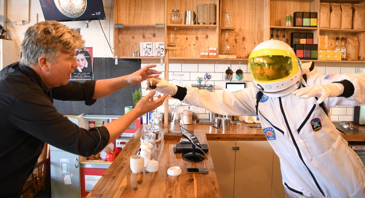 FRESH BREW: La Trobe University physicist David Hoxley and Get Naked barista Alex Davis work on their coffee brews. Picture: CHRIS PEDLER 