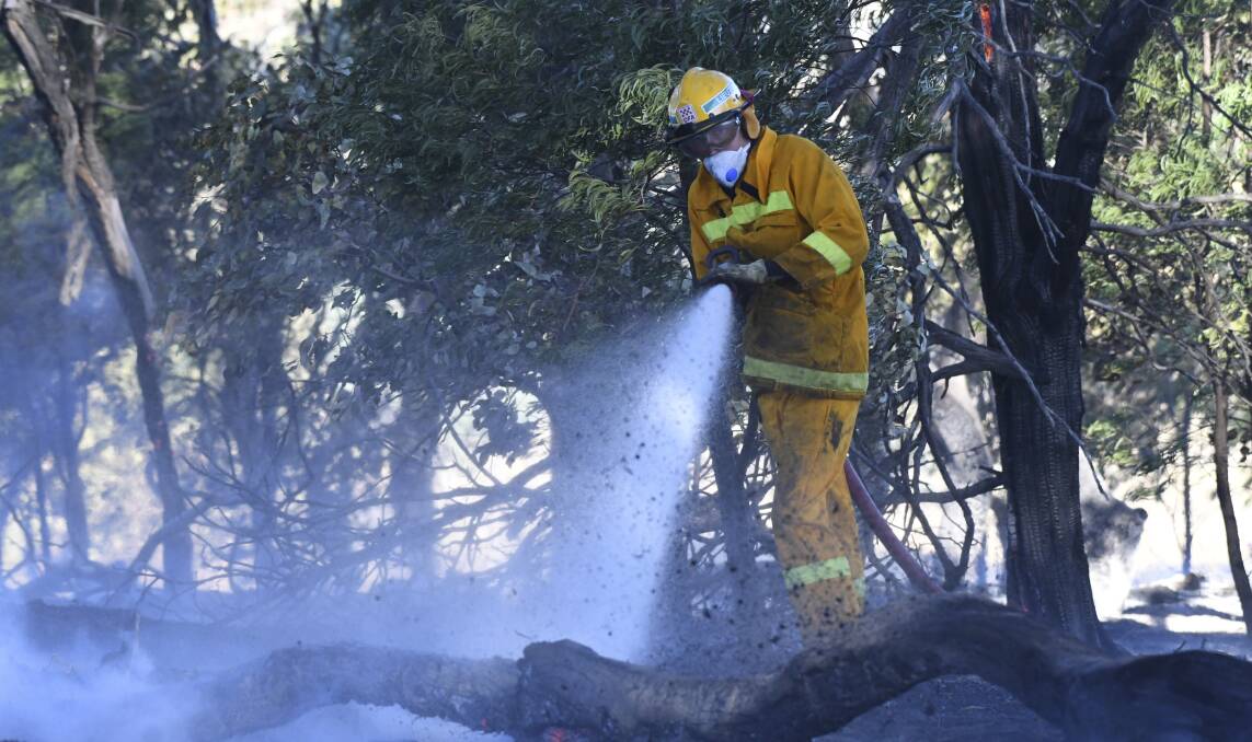 CFA cleans up after a fire at Mount Camel, near Heathcote, in 2018.
