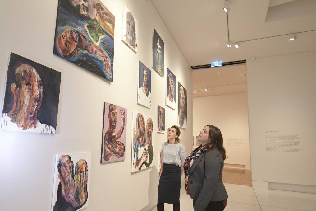 DISCUSSION: Bendigo Art Gallery curator Jessica Bridgfoot and curatorial manager Tansy Curtin consider some of Myuran Sukumaran's artwork. Picture: NONI HYETT