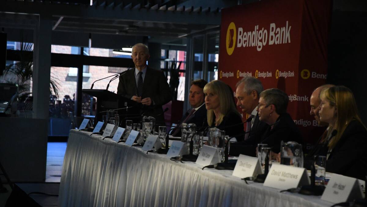 Robert Johanson watches Jacqueline Hey (third from left) speak at the Bendigo Bank AGM