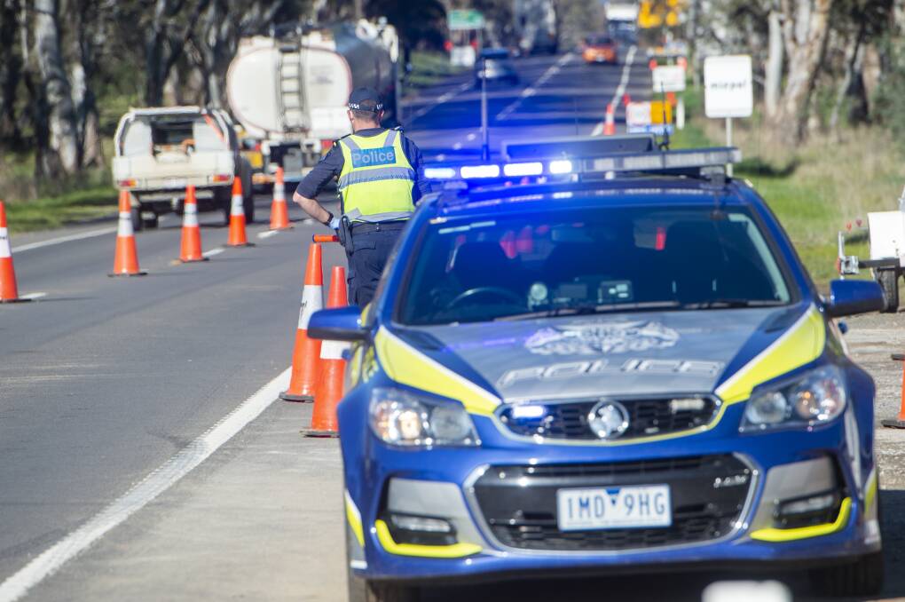 RESTRICTIONS: Police at a checkpoint on the border of Mitchell Shire and the City of Greater Bendigo. Picture: DARREN HOWE
