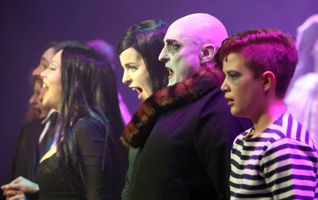 Conor Cunningham (seond from right) as Uncle Fester in BTC's The Addams Family.