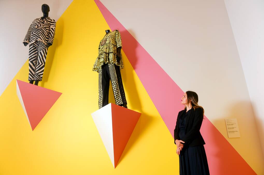 FASHION: Shonae Hobson, who curated the original Piinpi exhibition at Bendigo Art Gallery in 2020, with some of the pieces from the 2020 show. Picture: DARREN HOWE 