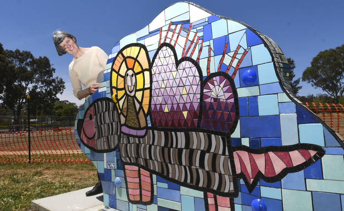 ARTWORK: Marion Da Costa admires one of Dunolly's new mosaic sculptures. The sculptures are now part of Central Goldfields Shire's permanent art collection. Picture: NONI HYETT