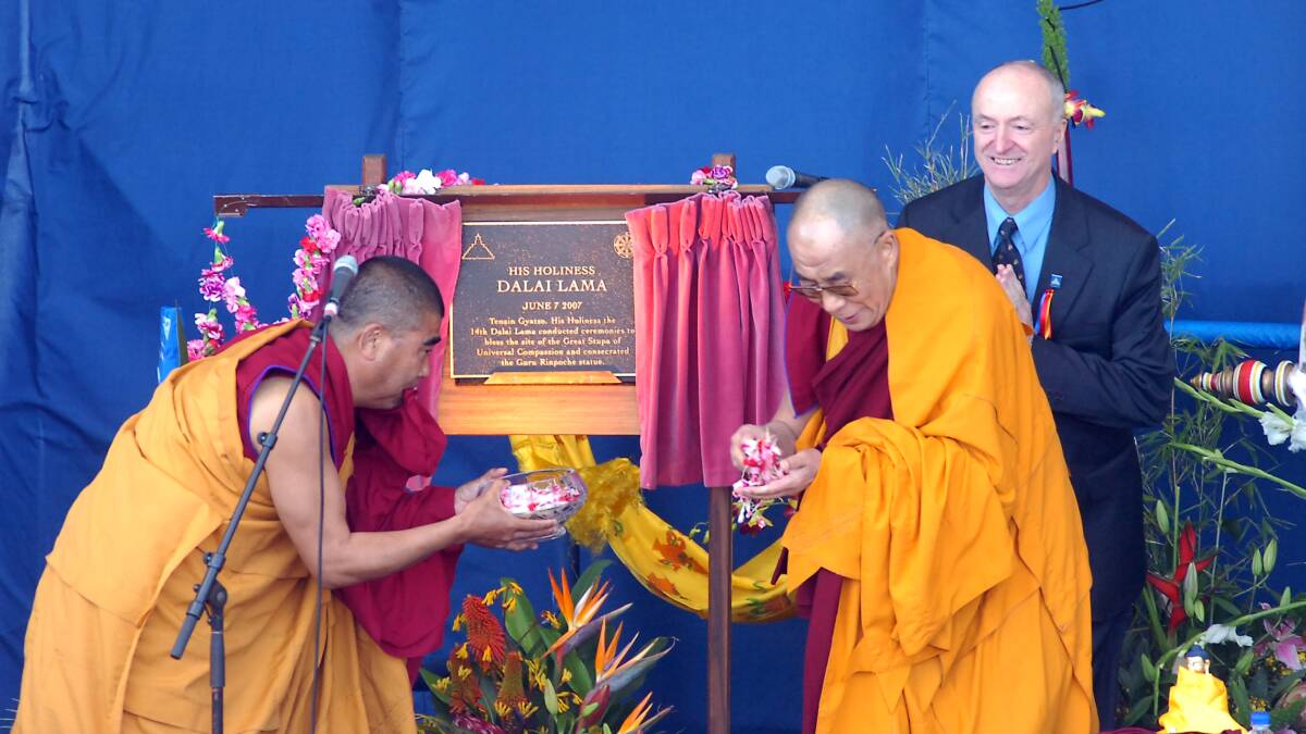 Opening and blessing the Atisha Centre in June, 2007. Venerable Kedrup handing petals to Dalai Lama as Ian Green looks on. Picture: Brendan McCarthy