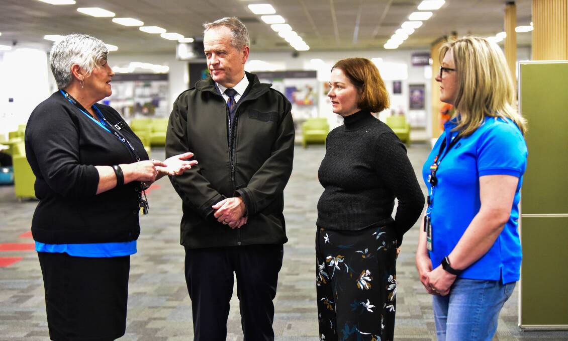 CONVERSATION: Government services minster Bill Shorten and Bendigo MP Lisa Chesters chat with Services Australia staff Trish Driscoll and Susan Barber. Photo: Brendan McCarthy