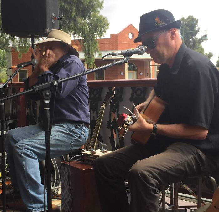 BLUES WITH A VIEW: Sydney act Doggn It Blues play on the balcony of The Rifle Brigade Hotel on Sunday. They were one of 17 acts to share two stages. Pictures: CHRIS PEDLER