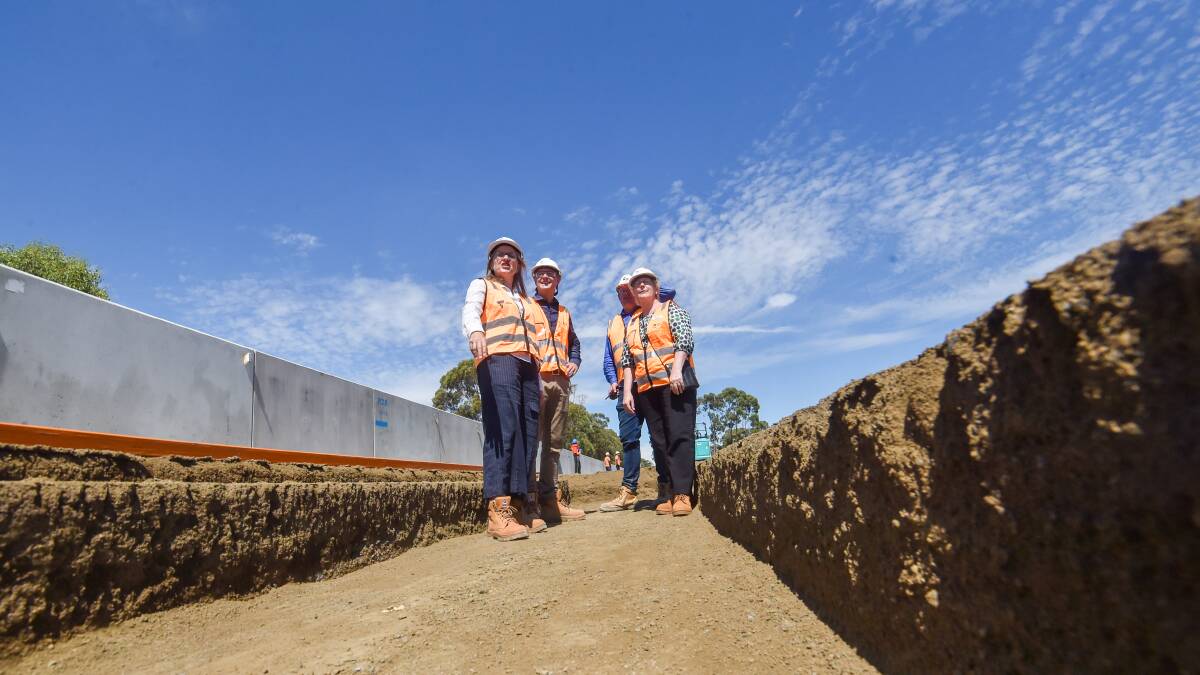 SITE: Jacinta Allan, Andrea Metcalf, Ben Henshall and David Patterson at the Huntly station site. Picture: DARREN HOWE