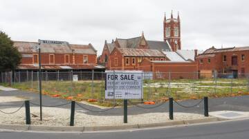 POTENTIAL: The vacant land at the corner of Williams and Mollison streets has been approved for the development of a hotel. Picture: DARREN HOWE