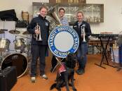 BRINGING THE BRASS: Marist Brass Band members Rachael Hamilton, Aidan Ratcliff and president Sally Spark with assistance dog River will take to The Capital stage this week. Picture: CHRIS PEDLER