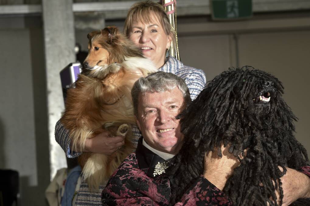 ALL SMILES: Julie Burnett and Collin Tenney with sheltie Minnie and Hungarian puli Nash at the Bendigo Dog Show. Picture: NONI HYETT 