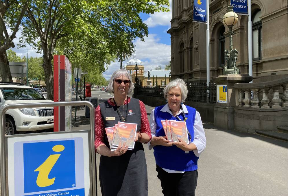 BACK IN BUSINESS: Bendigo Visitor Centre staff member Jill Millard and volunteer Cas Stedwell were busy helping tourists at the weekend. Picture: CHRIS PEDLER