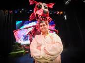 READY TO GO: Leroy Miller, who plays Shrek, with the dragon puppet created by the Nexus team for its production of Shrek. Picture: DARREN HOWE