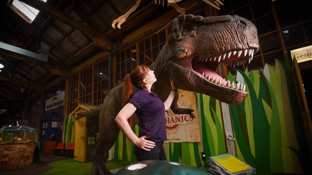 DINO: Discovery general manager Alissa van Soest with the centre's newest team member - a 2.5 metre tall Tyrannosaurus Rex. Picture: DARREN HOWE 