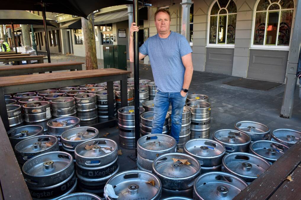 LOSS: Andrew Lethlean was forced to get rid of more than 30 kegs of beer, worth about $15,000, on Friday. Picture: BRENDAN McCARTHY