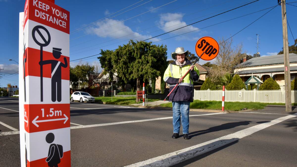 LOLLIPOP LADY: Crossing supervisor Ruth Lindrea is excited for students to return after some quiet weeks at her Gladstone Street crossing. Picture: BRENDAN McCARTHY 