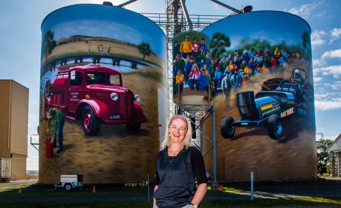 LOCAL: Colbinabbin Silo Art project submission manager Sadie Vale in front of two of the silos. Pictures: BRENDAN McCARTHY