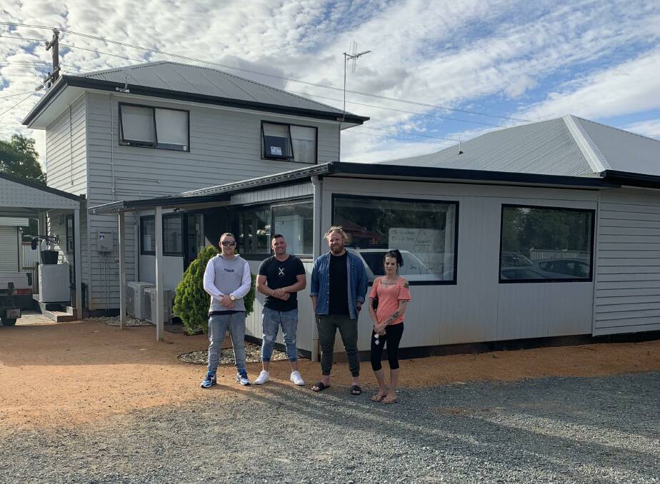 Residents of The Cottage, a community-driven rehabilitation facility in Shepparton, with a model that has been proposed as a possibility for Bendigo. Picture: SUPPLIED