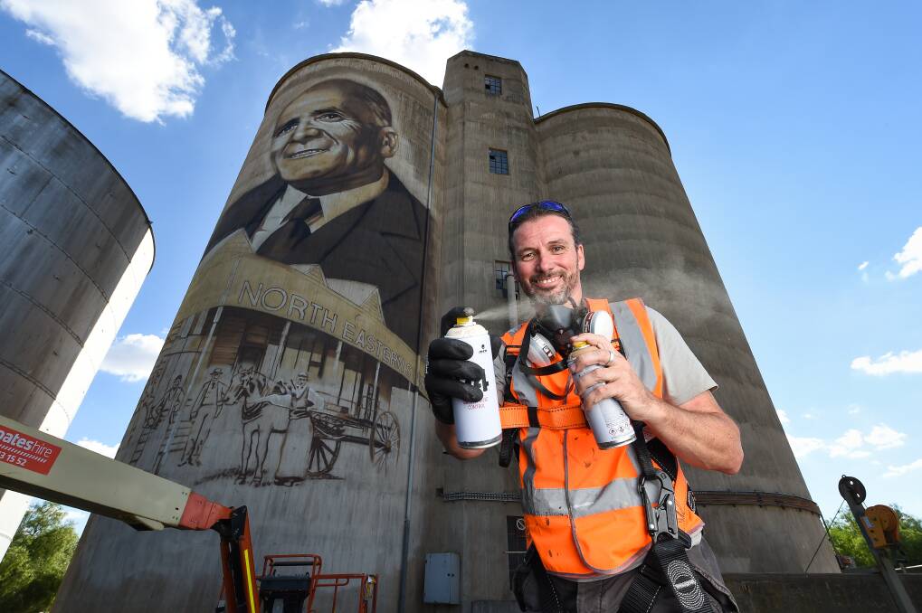 Tim Bowtell, pictured here with the St James silos, has been chosen to turn Colbinabbin's silos into a piece of art. Picture: MARK JESSER