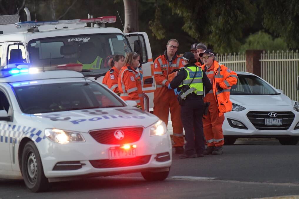 Emergency services near the scene of John Bourke's house on the day his body was discovered. Picture: NONI HYETT