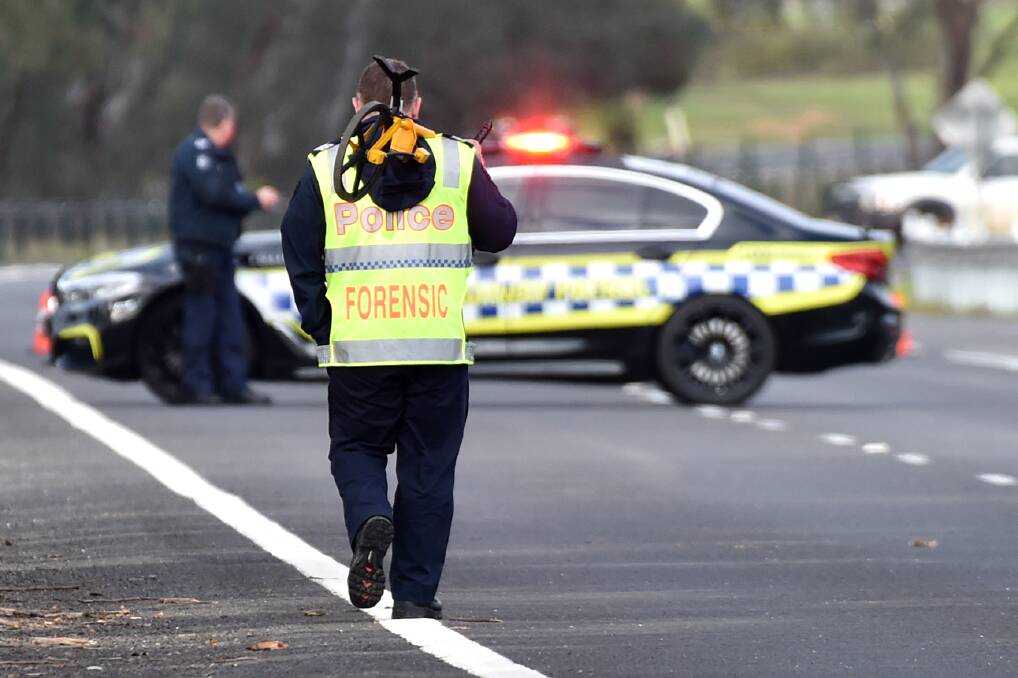 Investigators at the scene of a fatal crash in Kangaroo Flat last year. Picture: DARREN HOWE