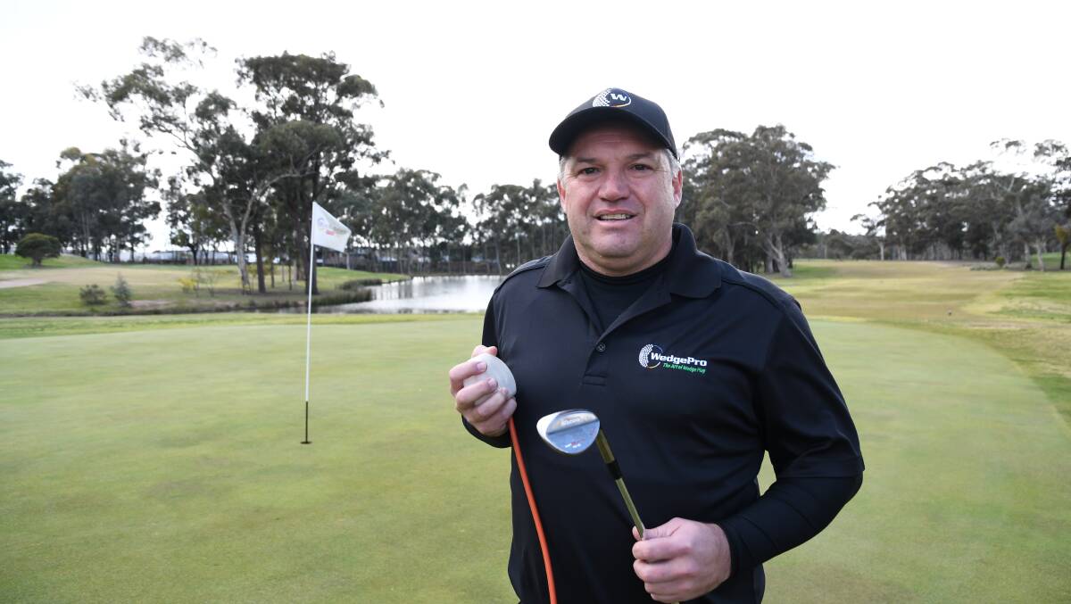 INNOVATION: Jamie Ward, one-quarter of the WedgePro team, with a version of the start-up's golf training aid. The team has won a spot in a new development program. Picture: NATALIE CROXON