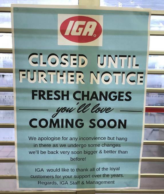 A sign outside Strath Village IGA after it closed at the end of August.