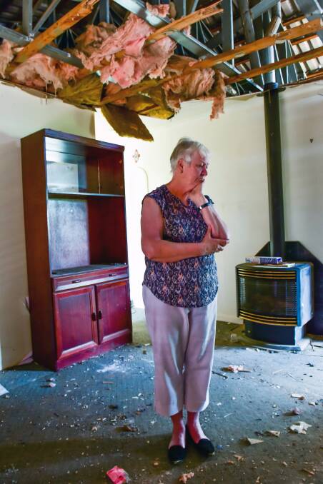 Noeline Keogh in her destroyed living room, less than two months ago. Picture: BRENDAN MCCARTHY