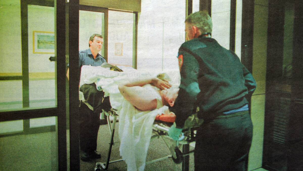 An injured officer is wheeled into the hospital.