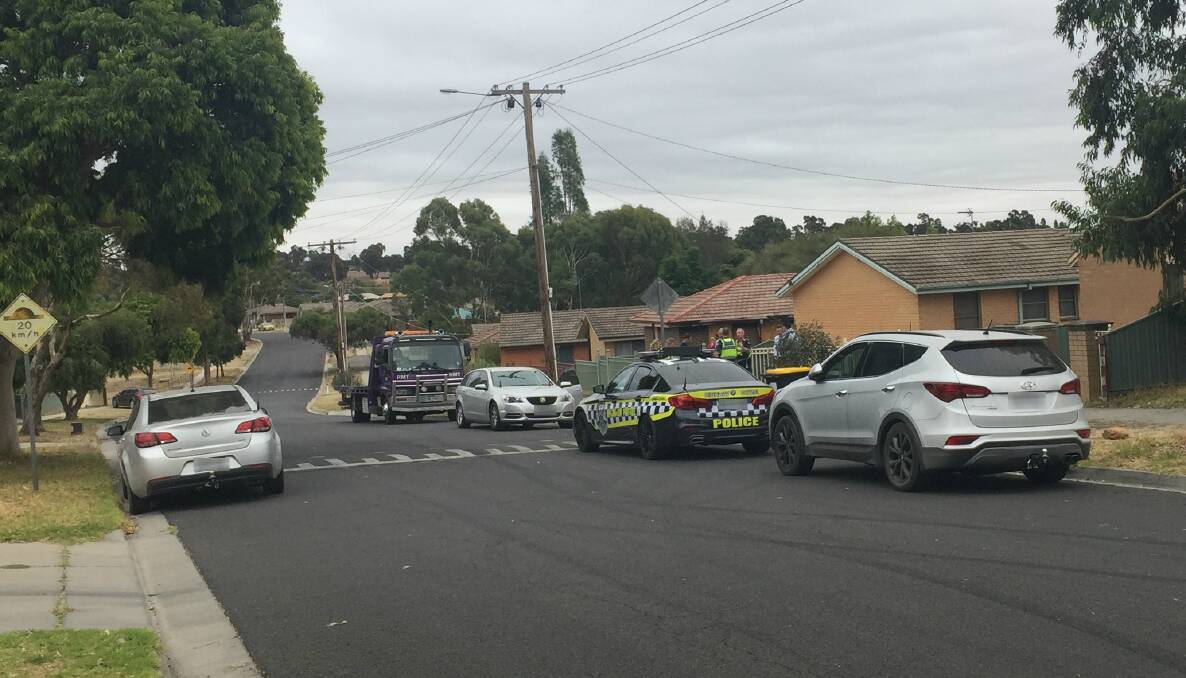Police in Derwent Drive, Long Gully, where a stolen car was located and a man was arrested.