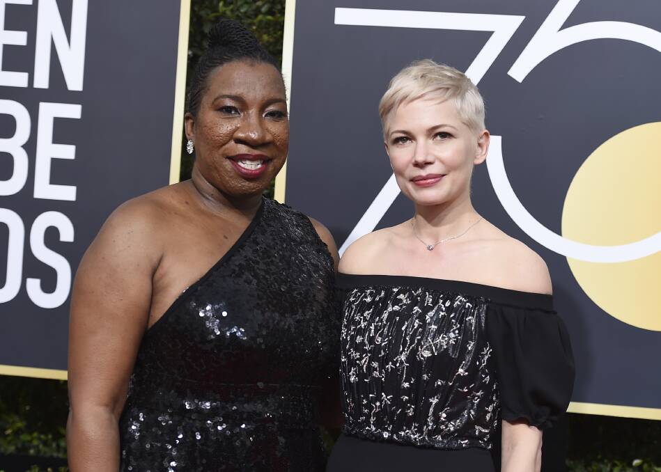 MESSAGE: Me Too movement founder Tarana Burke and actor Michelle Williams walk the red carpet in black. Picture: JORDAN STRAUSS/INVISION/AP
