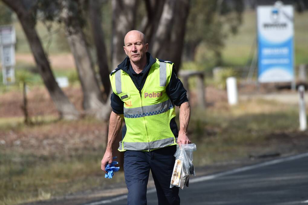 An officer from the Major Collision Investigation Unit at the scene of a fatal truck crash near Marong in October 2019. Picture: DARREN HOWE