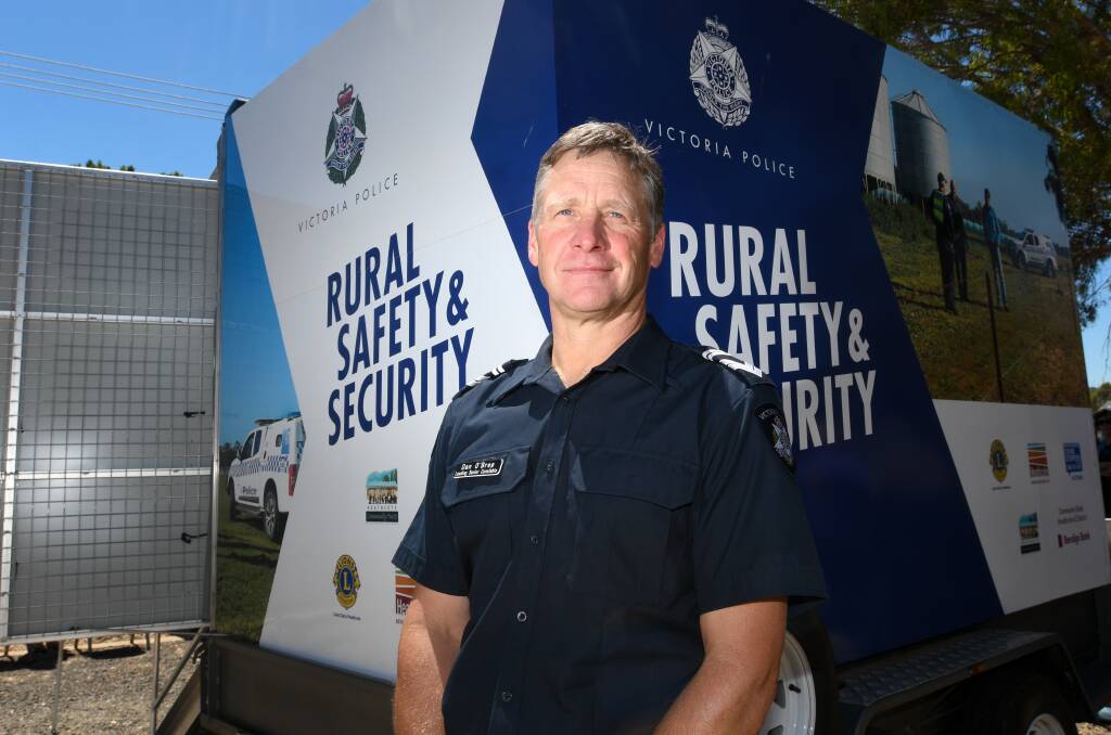  Leading Senior Constable Dan O'Bree, a farm crime liaison officer, with the trailer donated by the Heathcote community. Picture: NONI HYETT