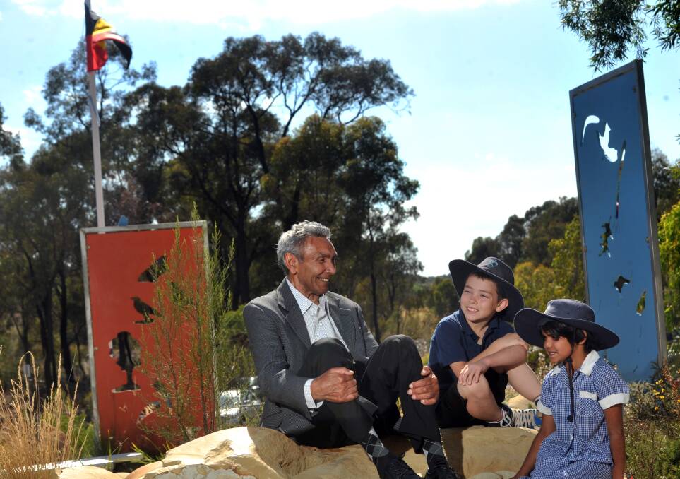 Uncle Brien Nelson at the opening of Eaglehawk North Primary School's Koori Garden, with students Tristan Perceval and Caitlyn Mitchell. Picture: BRENDAN MCCARTHY