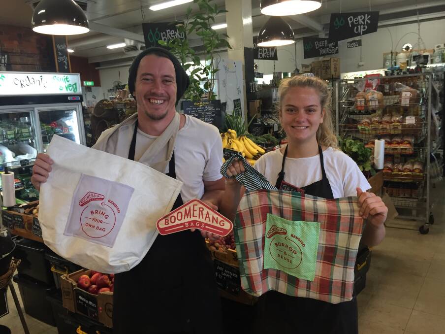 SUSTAINABLE: Thomas Prince and Jess Burch from BendiGo Wholefoods, with some of the Boomerang Bags.