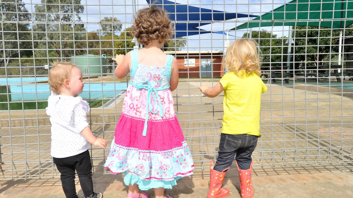CAMPAIGN: Colbinabbin children Isabelle Hill, Ruth Woodman and Everlyn Wilkinson at the town pool. Picture: NONI HYETT