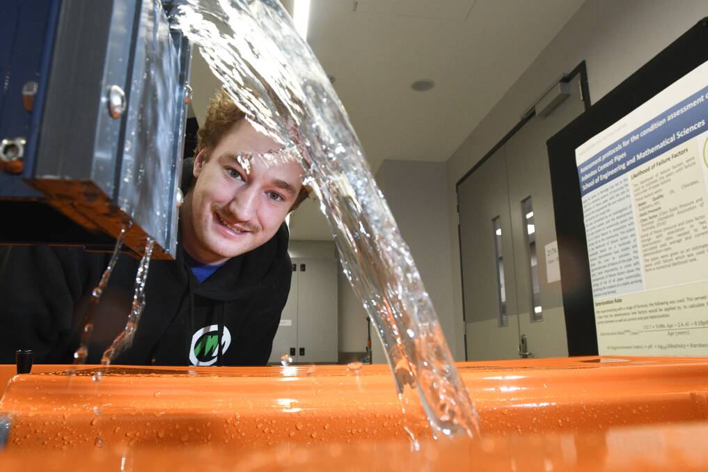 PURPOSE BUILT: Student Trent McNamara takes a look at the hydraulics set-up in La Trobe University's new engineering and technology building. Picture: NONI HYETT